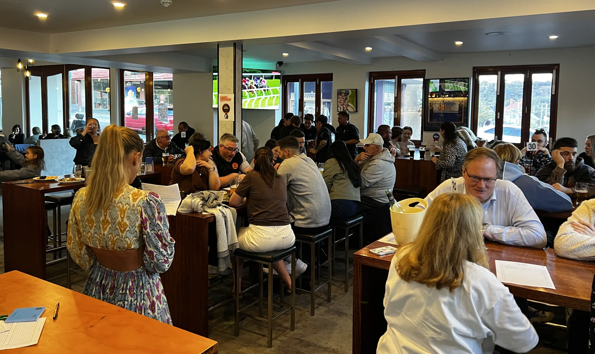 People enjoying a meal in the Queen’s Head dining room