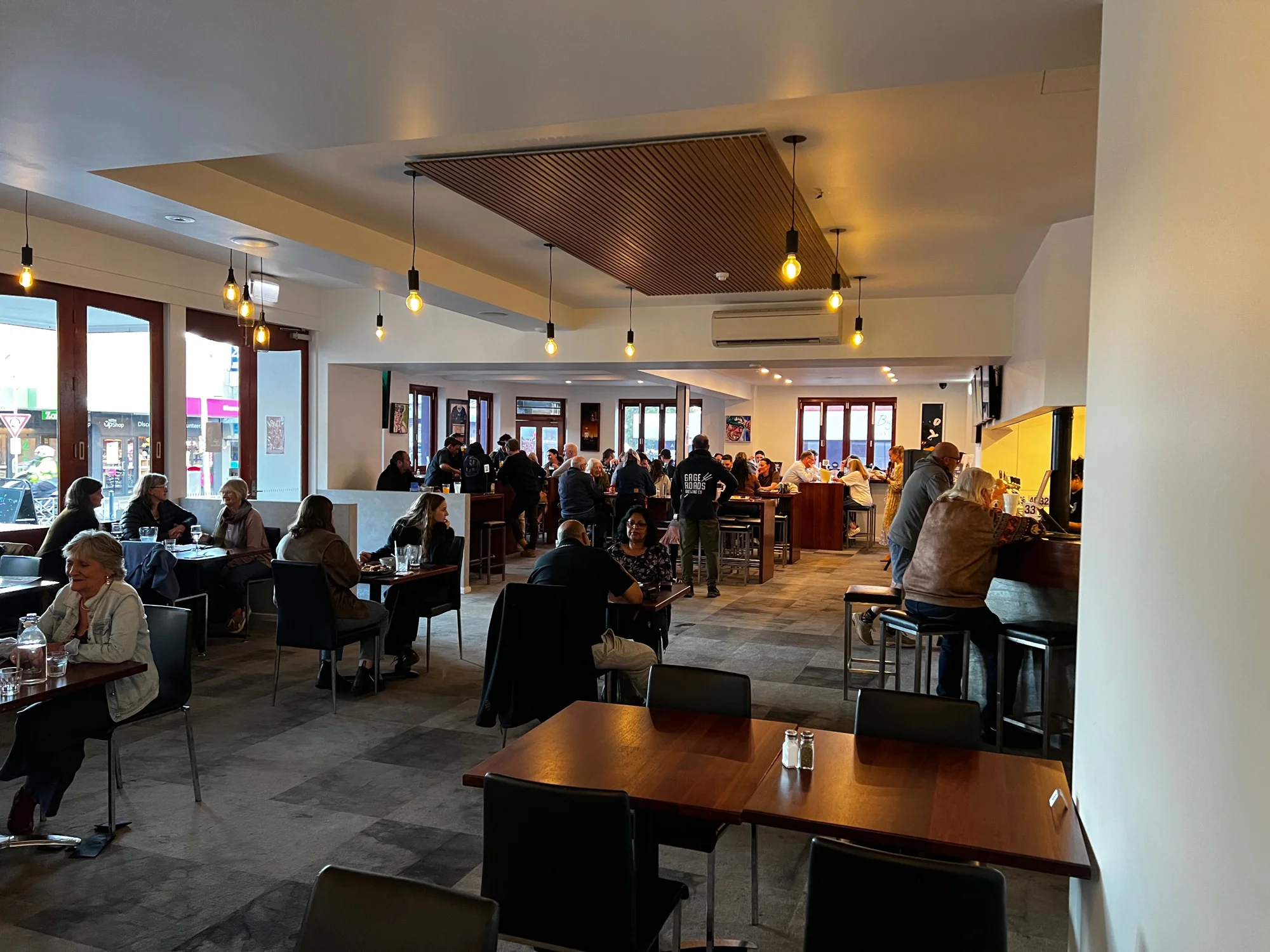 Guests in the downstairs pub and dining area at the Queen’s Head Hotel